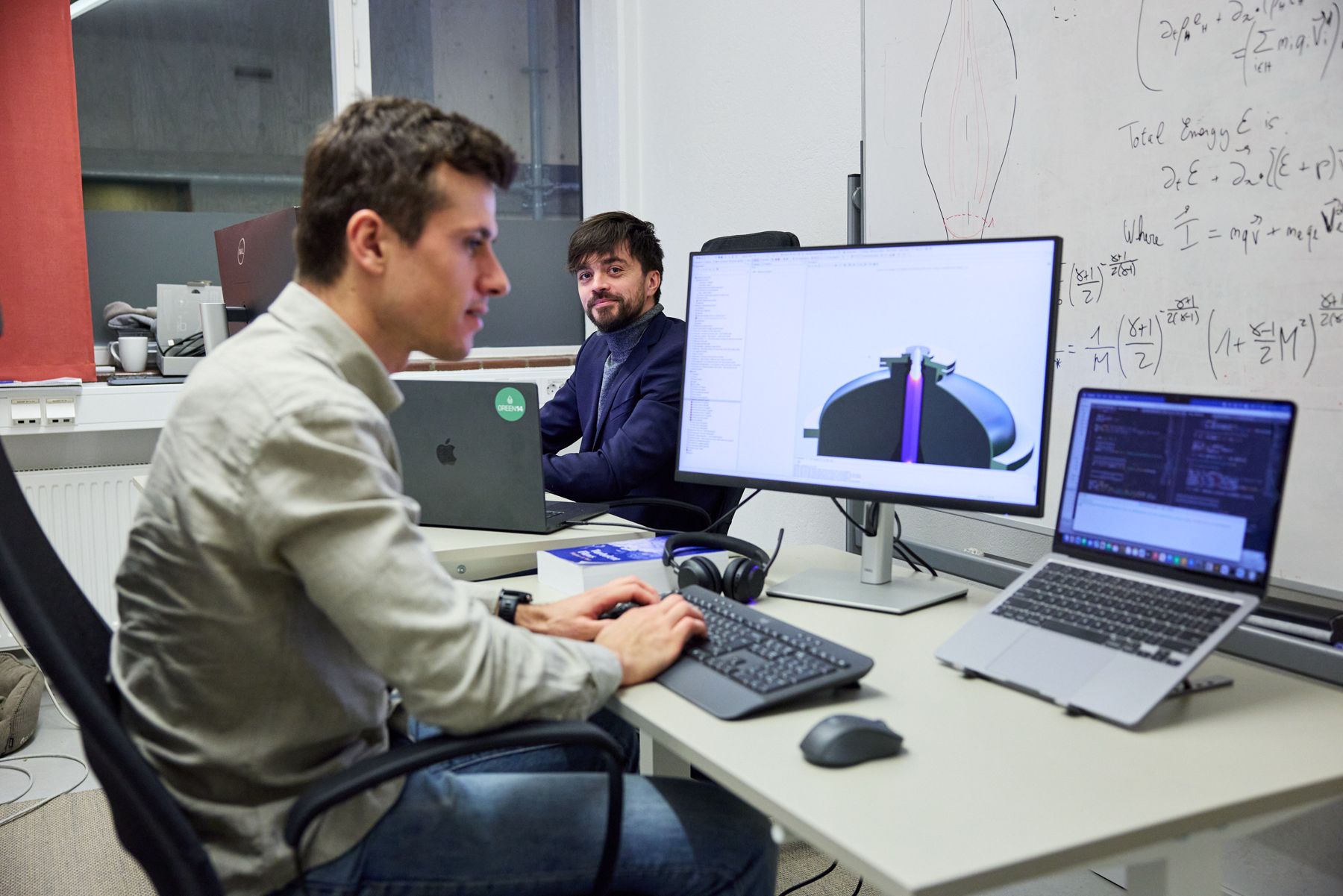 GREEN14 engineers reviewing simulations and reactor data